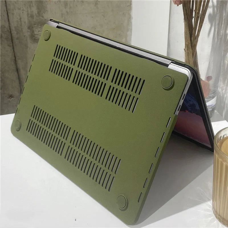Quicksand army green polycarbonate MacBook protective shell on a laptop showing textured finish.