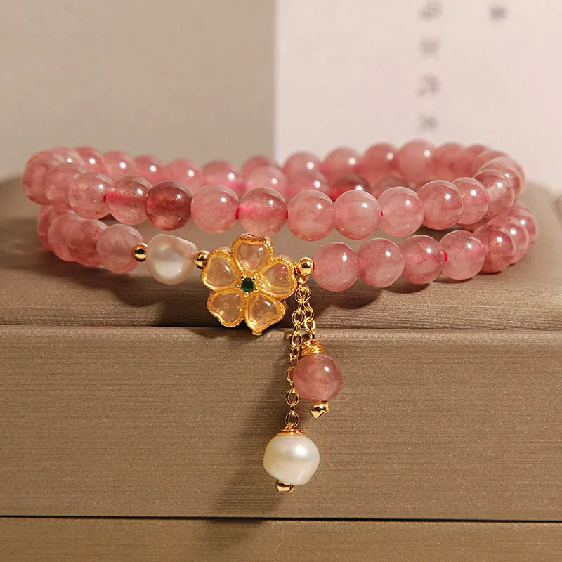 Women's twin ring bracelet with strawberry quartz four-leaf clover charms in Japanese Korean style