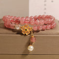 Women's twin ring bracelet with strawberry quartz four-leaf clover charms in Japanese Korean style