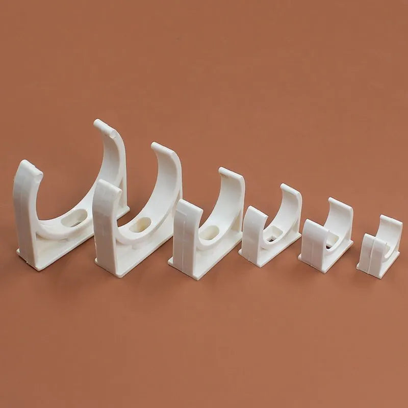 Pack of PVC U-shaped pipe clamps in various sizes for pipe routing