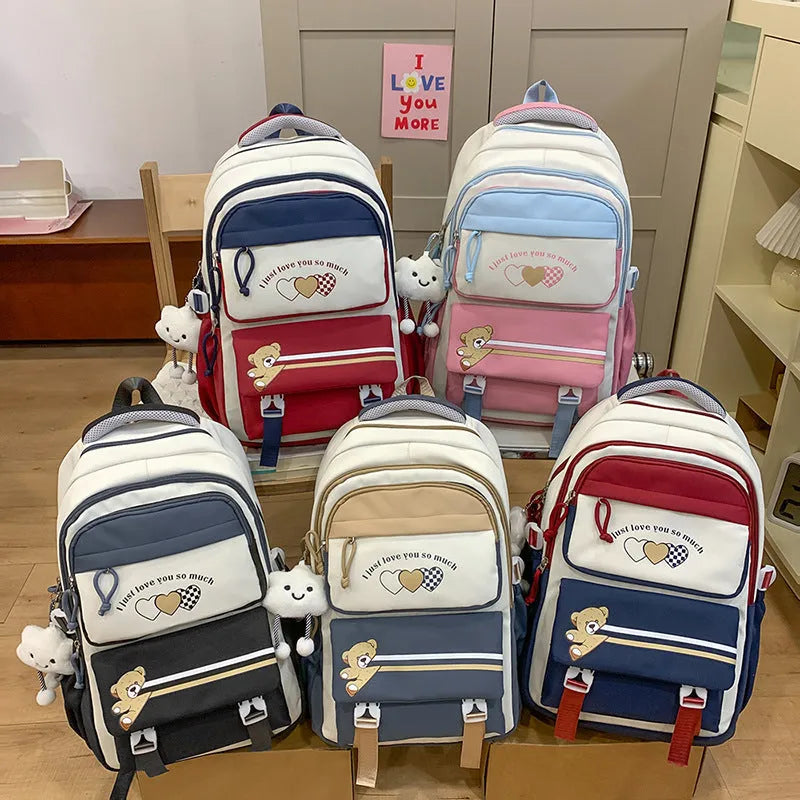 Nylon burden alleviation backpack for girls in pink long leg cloud design with outer sandwich pocket and stitching details