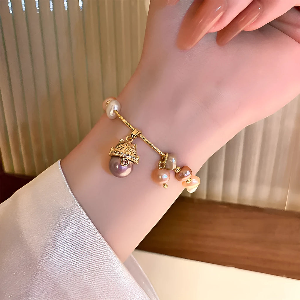 Baroque freshwater pearl zircon bracelet with geometric inlaid design and magnetic clasp on a white background