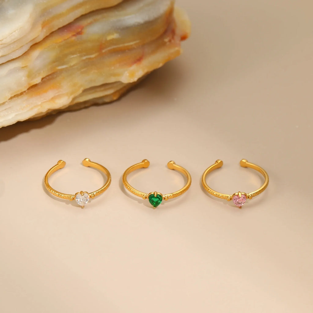 Heart-shaped open-ended ring with geometric design and inlaid zircon detail in stainless steel