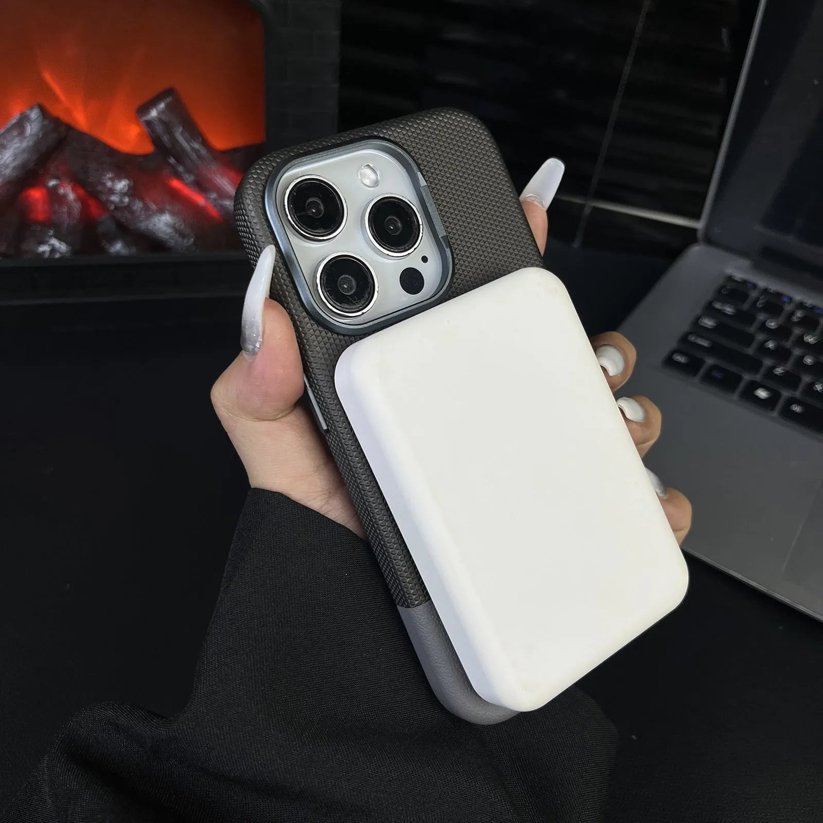 Black iPhone case with dragon scale texture and stitching, showing magnetic all-inclusive shockproof design