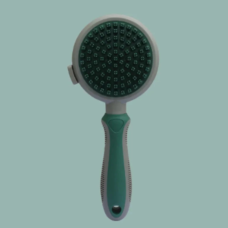 Green and pink 2-in-1 silicone cat hair brush with retractable slicker brush and massaging head.