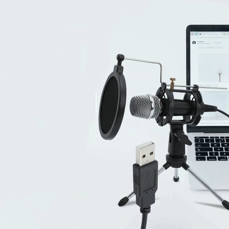 Black mini condenser microphone on an aluminium stand with 3.5mm and USB cables for computer or phone.