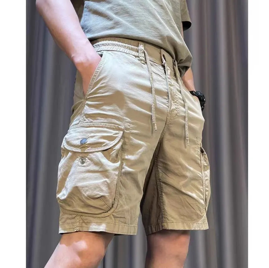 Loose straight-leg casual overalls trousers with multiple pockets in khaki colour.