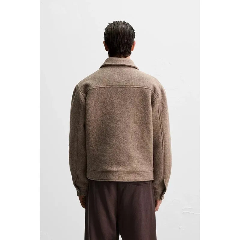 Men's taupe loose wool woven lapel long sleeve single-breasted casual jacket coat on a model