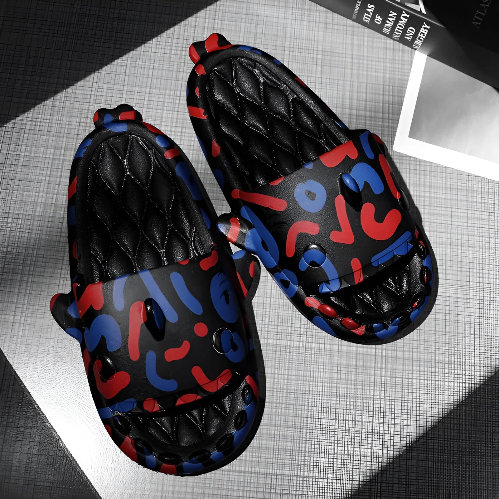 Shark design open-toe slippers in EVA material on a white background.