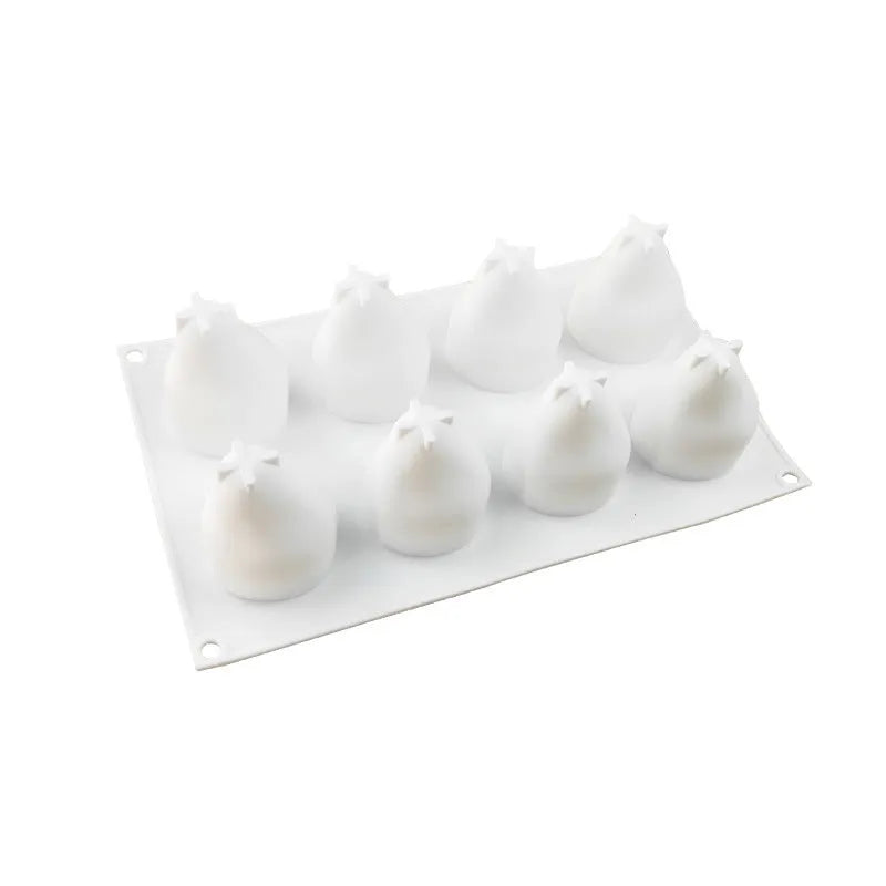 Set of six silicone baking moulds shaped like pineapples and pine cones