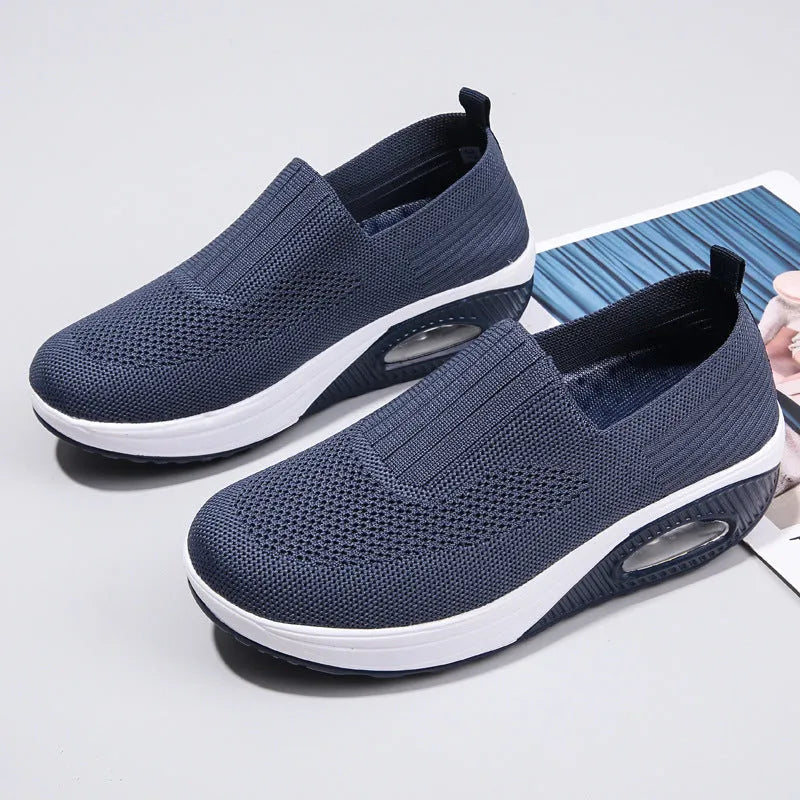Women's mesh running shoes with air cushion midsole in beige colour showing round toe design