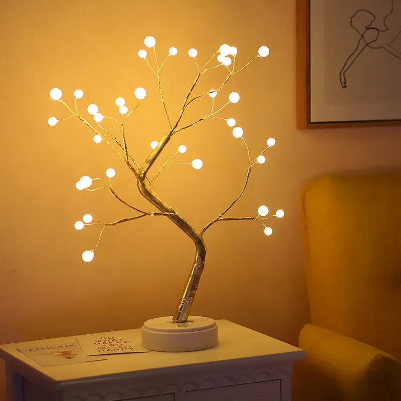 Tree light night light with bonsai-style design, warm white LED lights, adjustable branches, and USB plug.