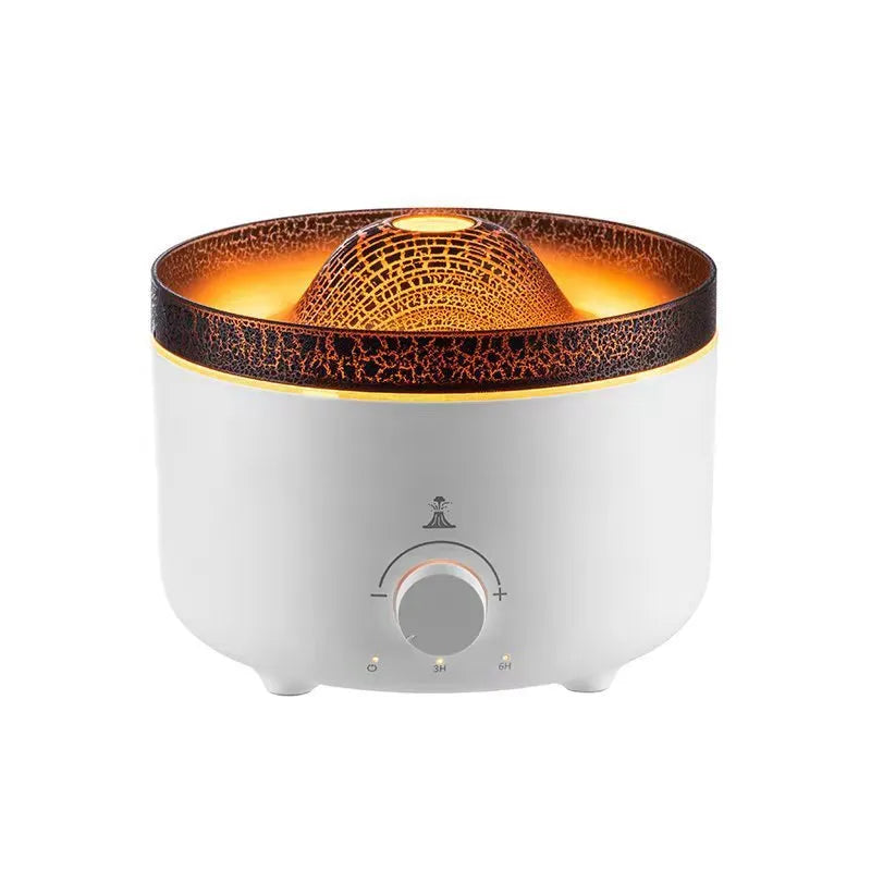 White columnar simulated flame volcano humidifier with remote control on wooden surface