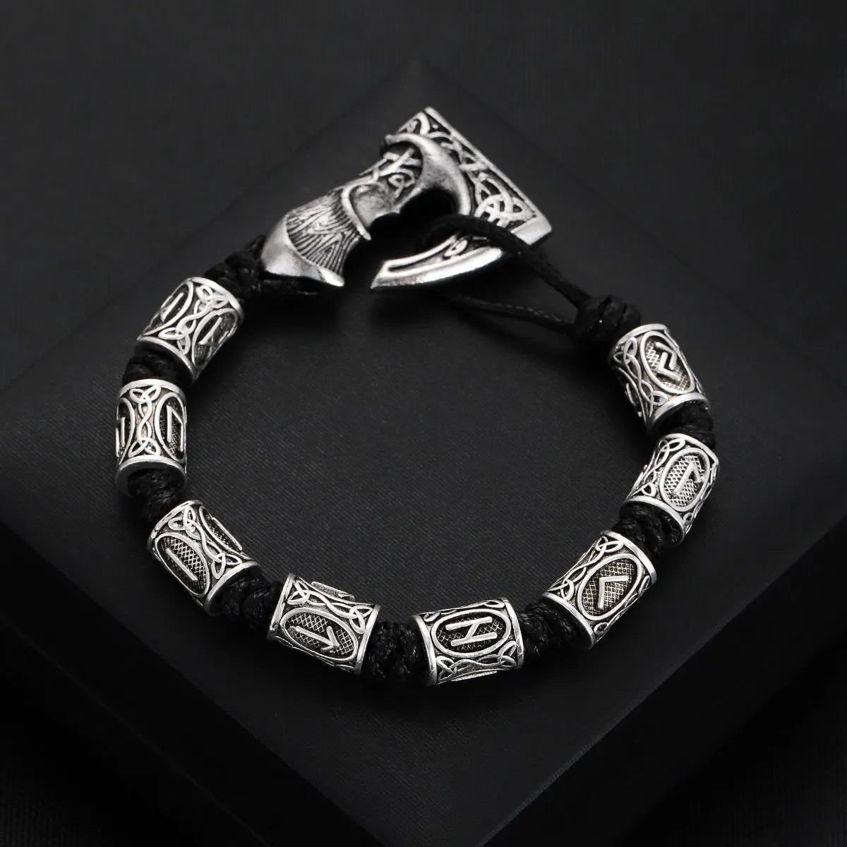 Handmade alloy rune lettering spacer beads woven bracelet on surface, three colour options available