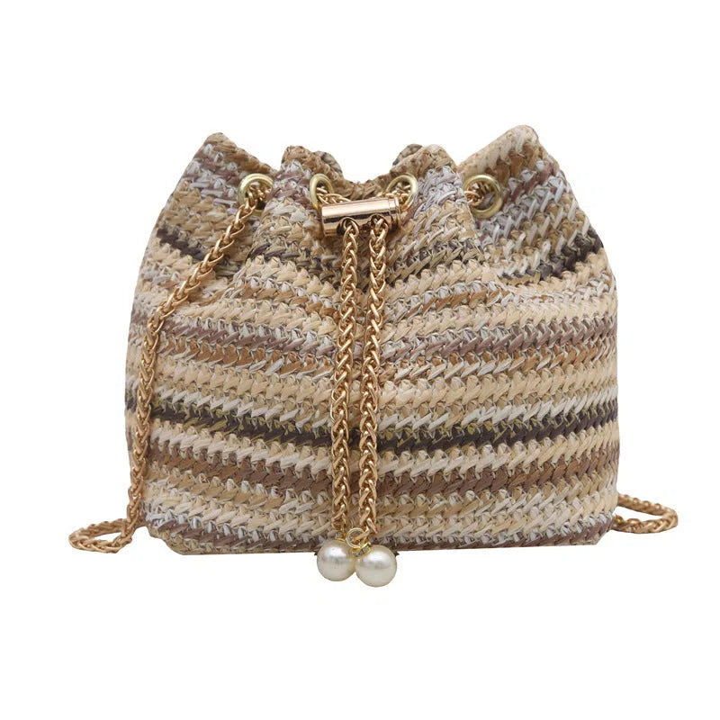 Multicolor straw weave bucket bag with plaid pattern, chain strap, and diamond embellishments