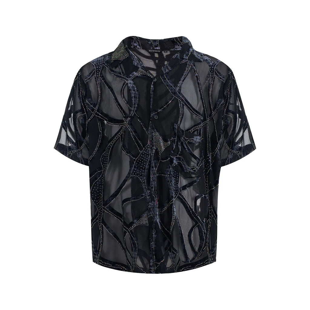 Man's black and grey snake pattern short-sleeved shirt with loose fit and lapel collar.