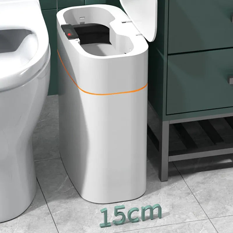 White induction smart trash can with automatic lid on a kitchen floor.