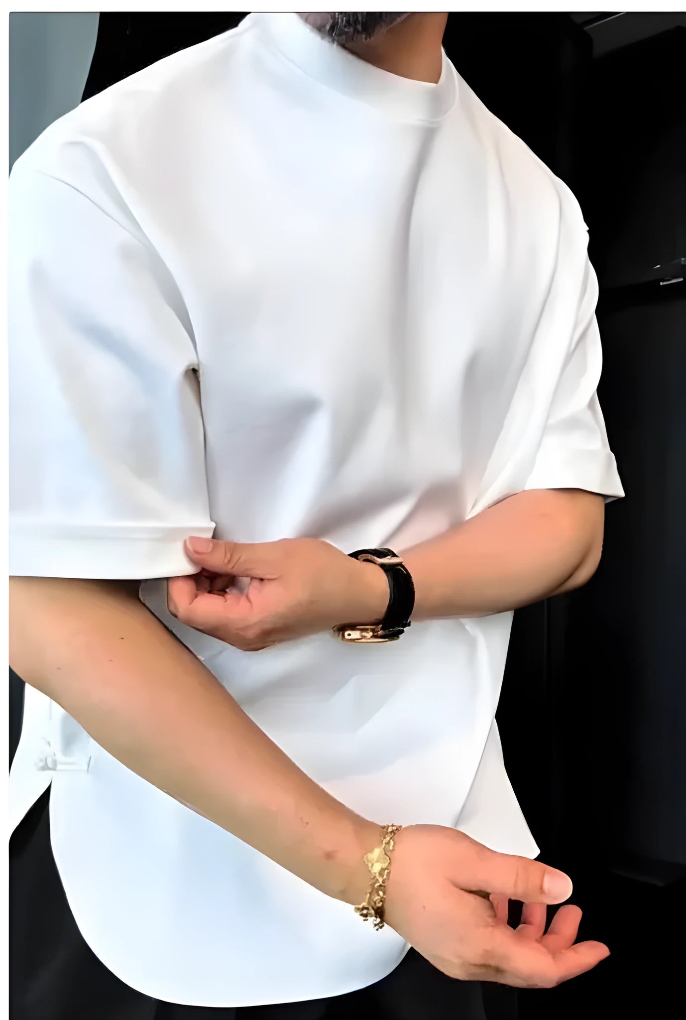 Men's white button-front t-shirt with short sleeves and a round hem on a neutral background.