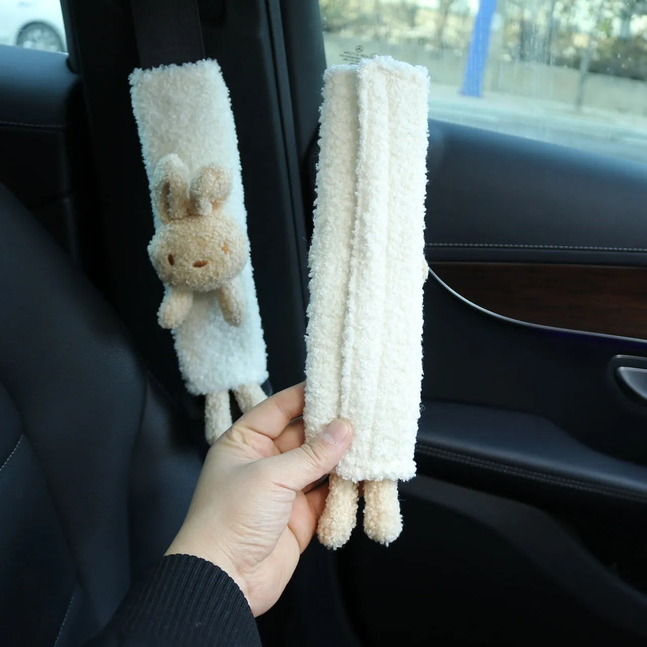 Cartoon plush lamb's wool shoulder protector for car seat belt in rabbit and bear designs.