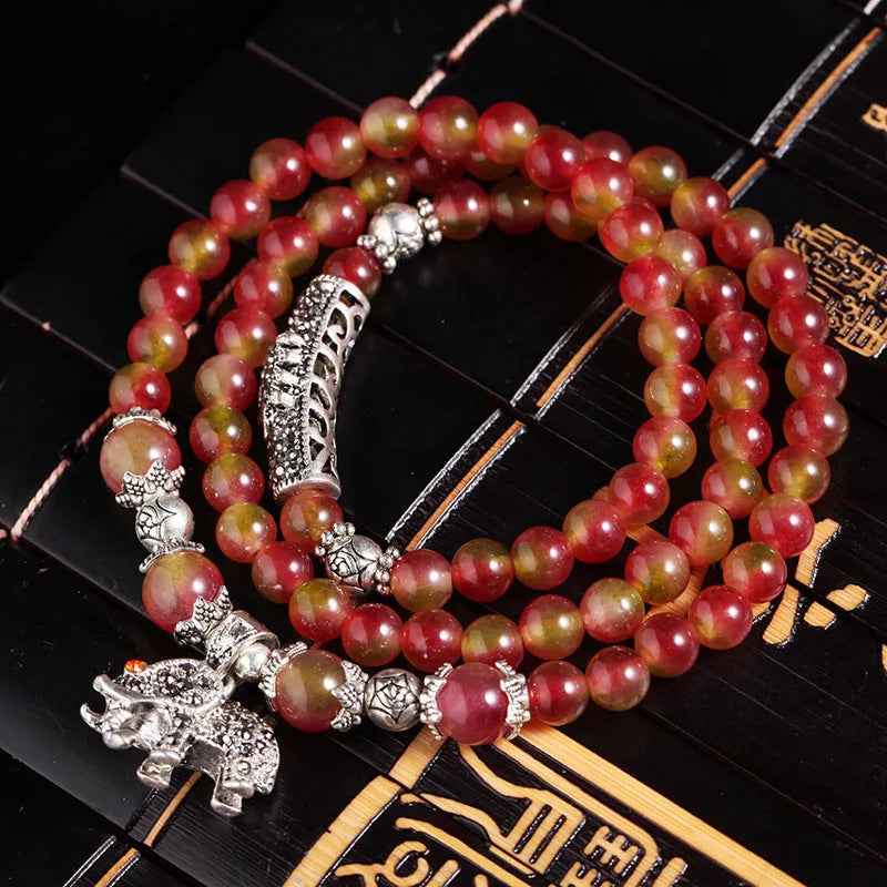 Handmade natural watermelon crystal bracelet with Chinese knot closure in national style.