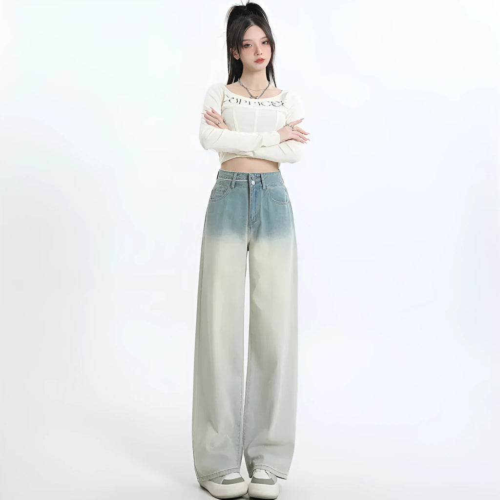Gradient blue straight-leg women's jeans on a neutral background showing the colour transition.