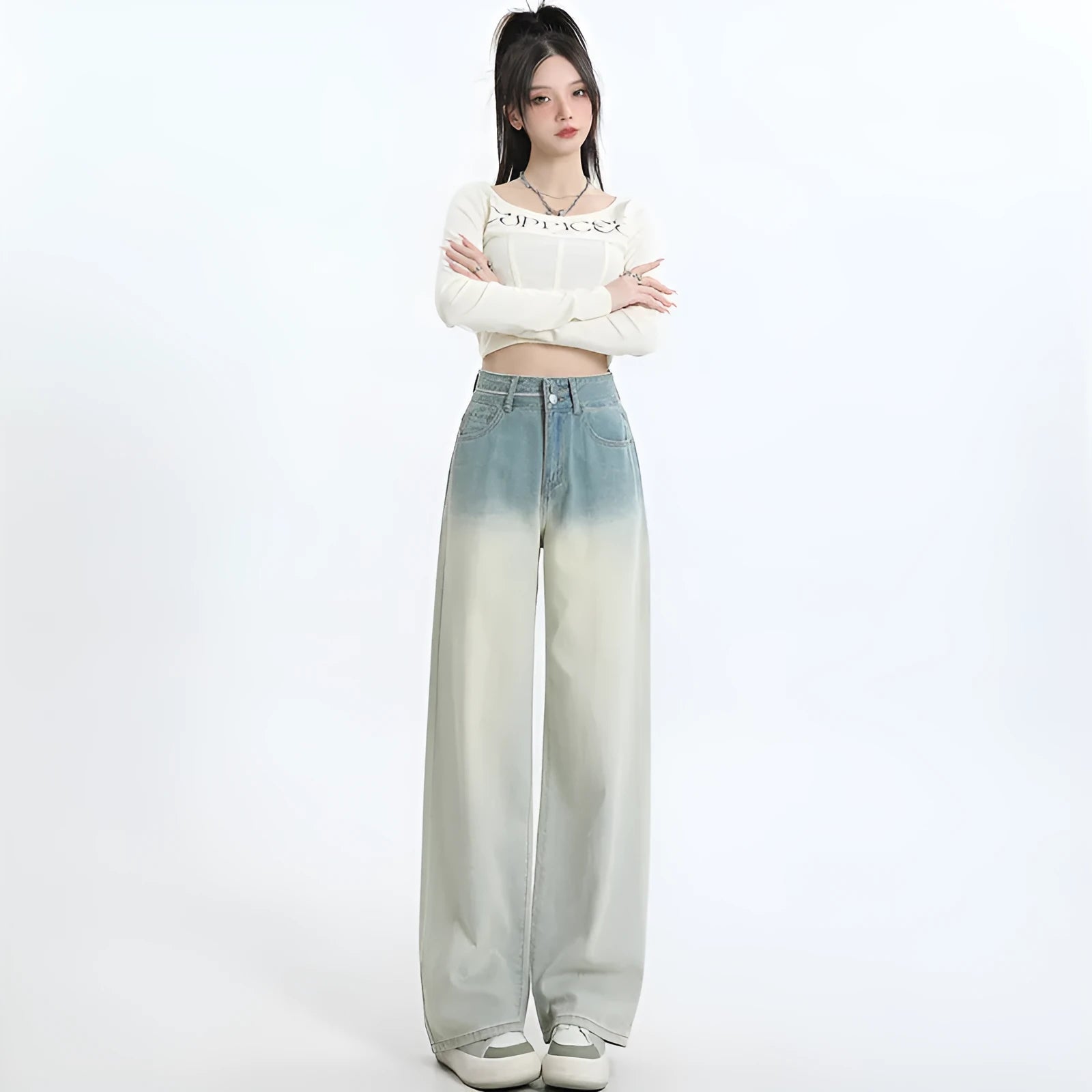 Gradient blue straight-leg women's jeans on a neutral background showing the colour transition.