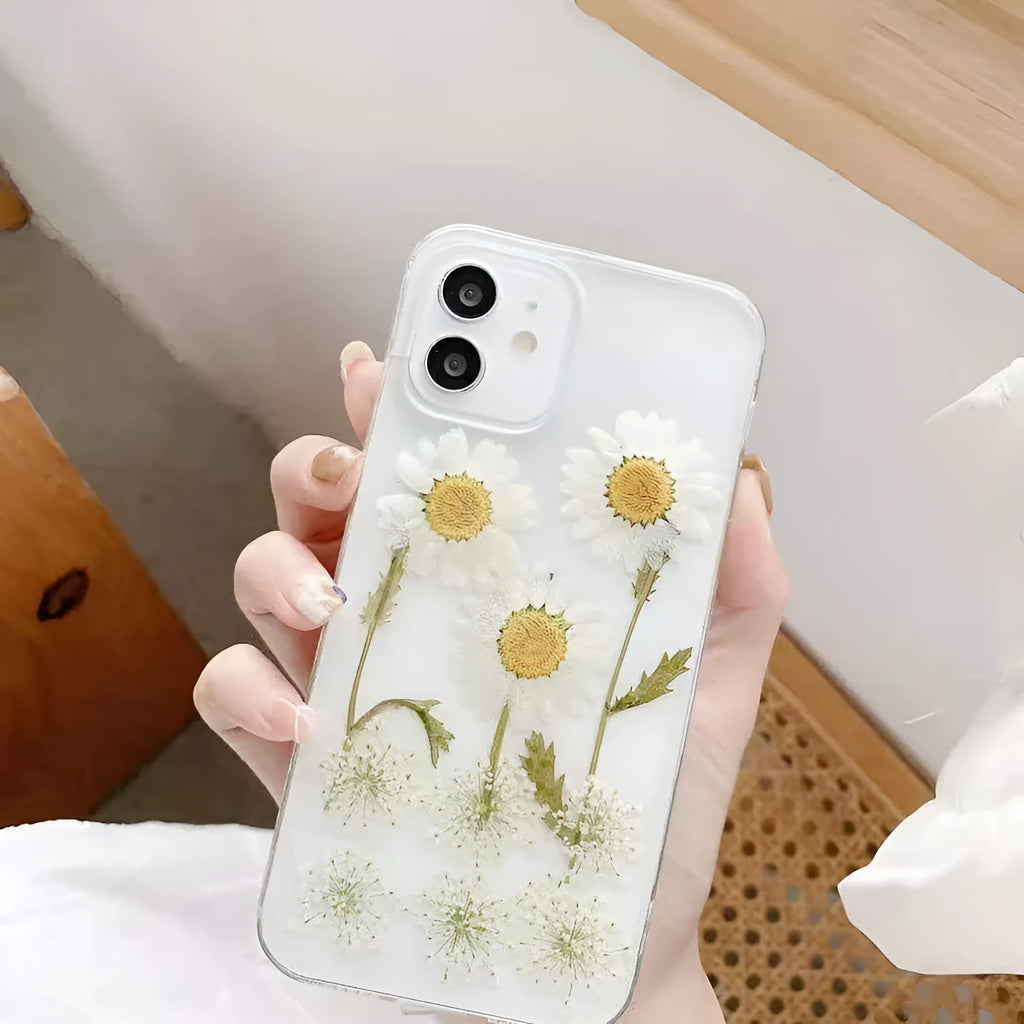 White epoxy daisy floral pattern on a glass back iPhone protective case.