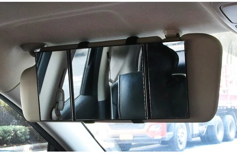 Silver car folding makeup mirror shown closed at 15.5cm and opened to 30.5cm wide.