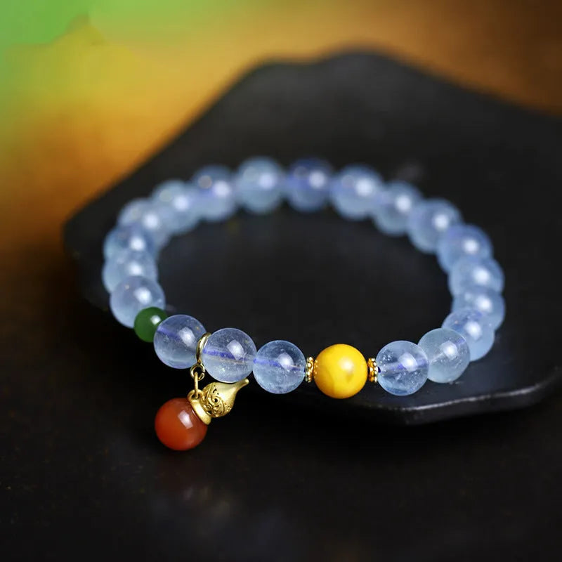Women's aquamarine bracelet with 8mm geometric beads in iced aquamarine colour and ethnic retro style