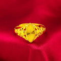Gold-coloured brass ring with geometric open diamond flower pattern and textured surface