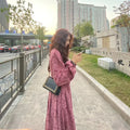 Red floral pattern cotton knit dress with elastic high waist and three-quarter princess sleeves.