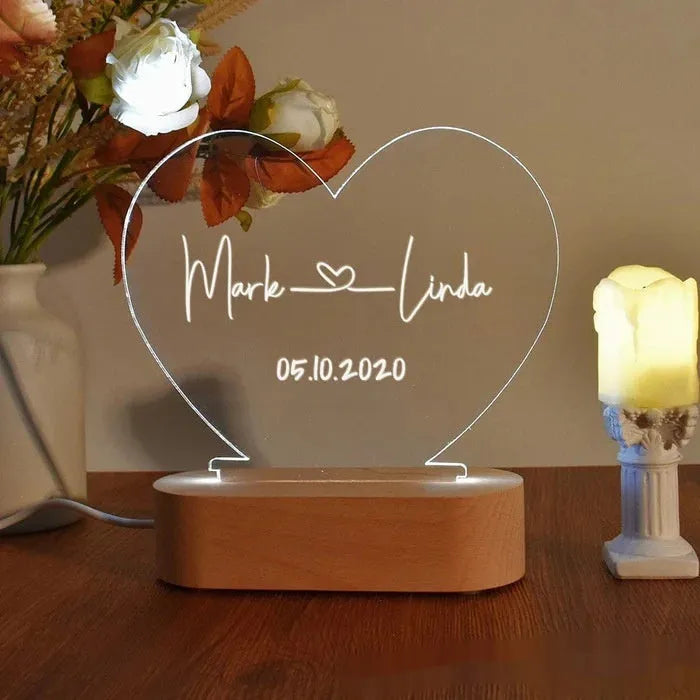 Custom acrylic night light with personalised names and date, showing dimensions of 20cm by 11.5cm.