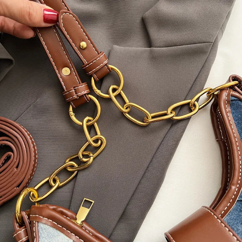 Brown denim women's bucket shoulder bag with diamond mesh detail and chain strap connector.
