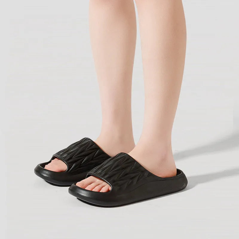 Pair of EVA leaf texture design slippers in multiple colour options on a white background.