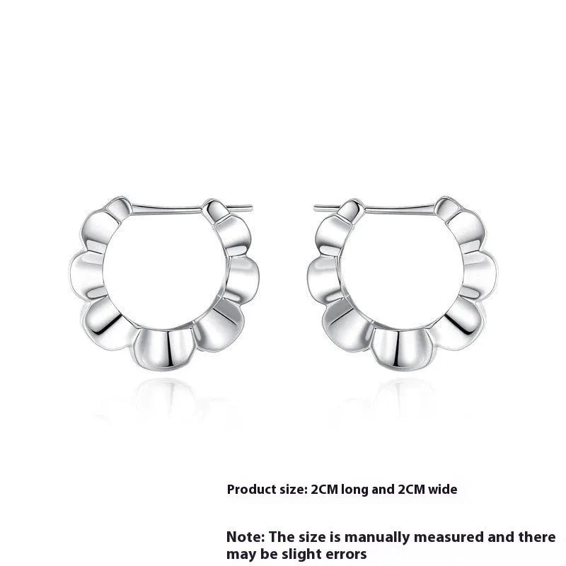 Sterling silver geometric drop earrings with round retro design elements