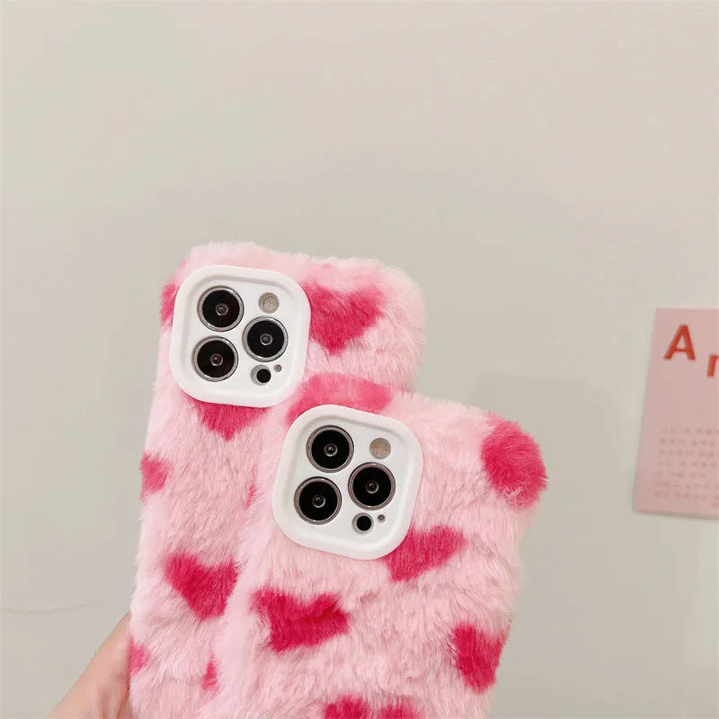 Pink silicone iPhone case featuring a Love Plush cartoon design on the back.