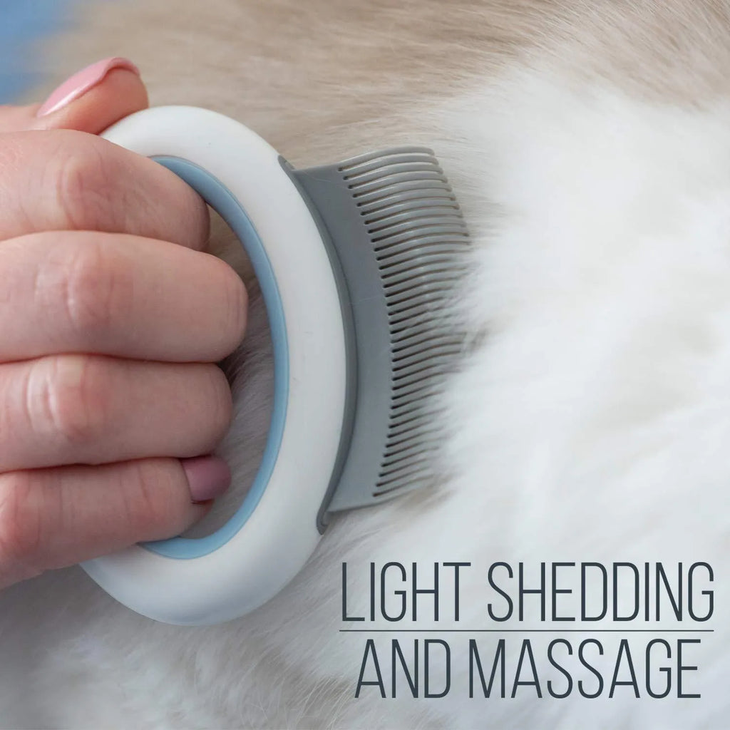 Blue plastic pet grooming comb for deshedding cats and dogs on a white background.