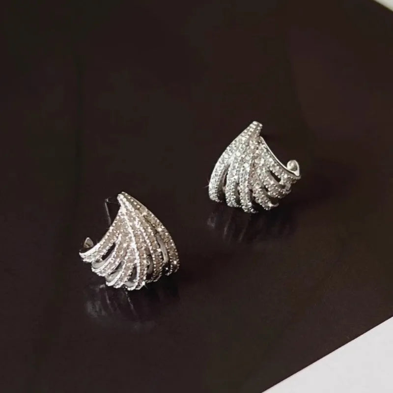 A pair of women's geometric design zircon earrings with a platinum colour electroplated finish.
