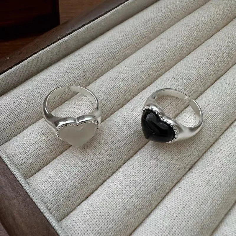 Adjustable sterling silver ring with heart-shaped black agate in open-mouth design