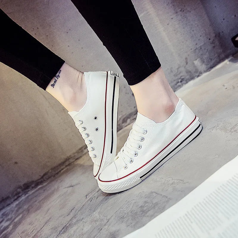 Women's solid colour casual canvas shoes in a lace-up style on a white background.