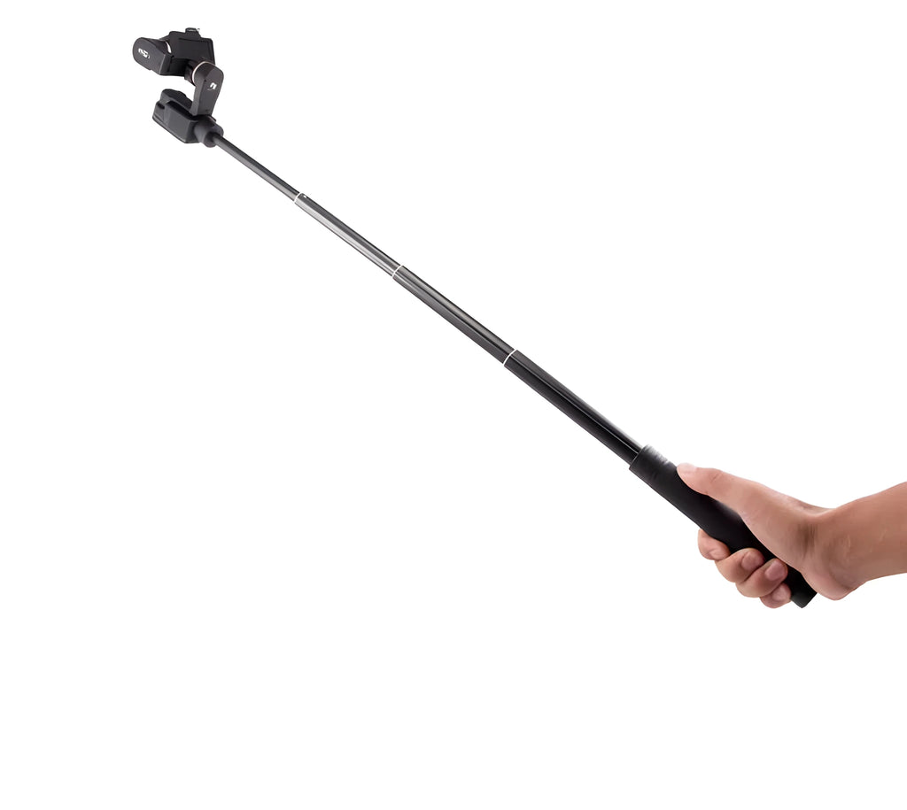 Black retractable aluminium selfie stick extended to full length with a smartphone attached in the clamp.