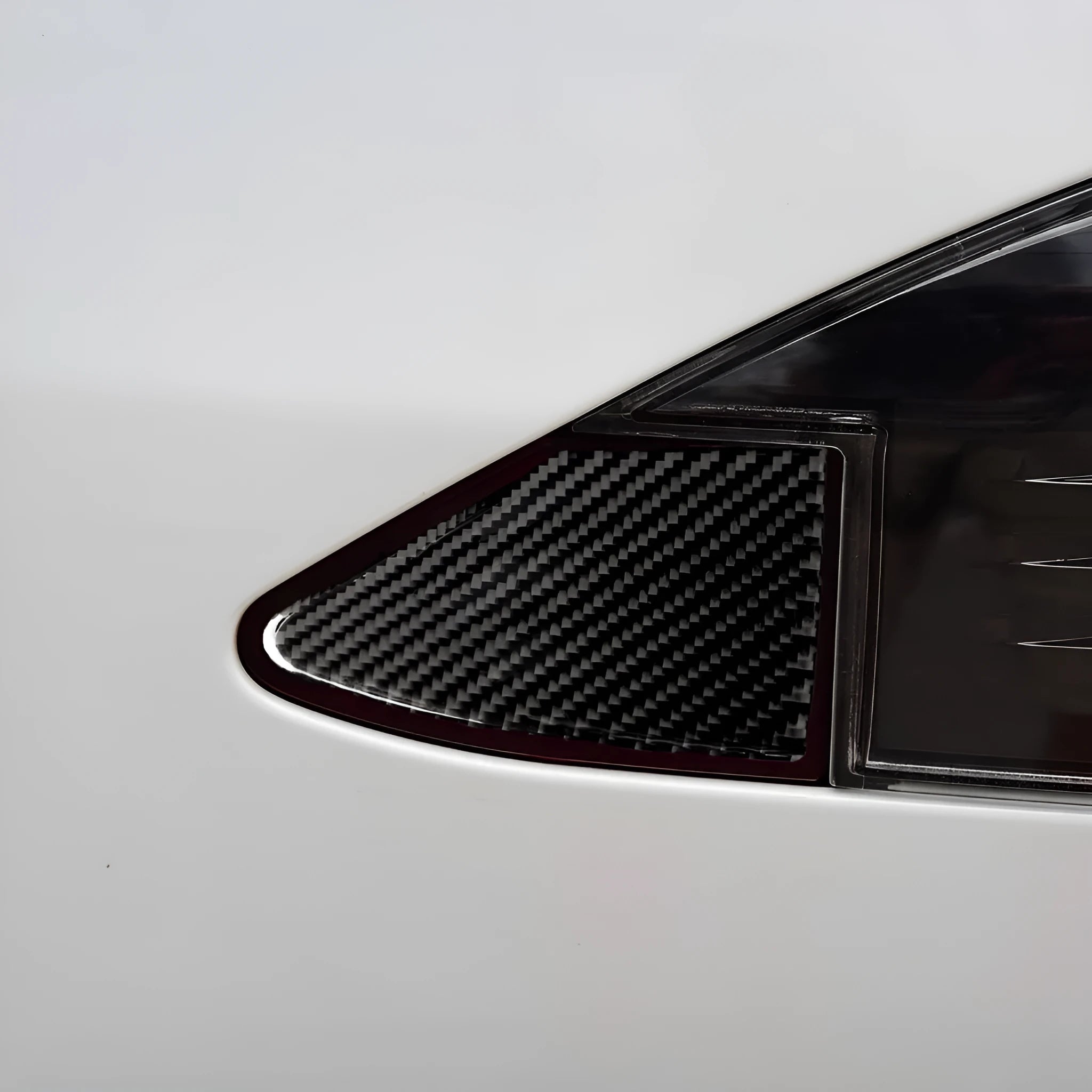 Carbon fibre decorative sticker for covering a USB charging port panel, showing the 3M adhesive backing.