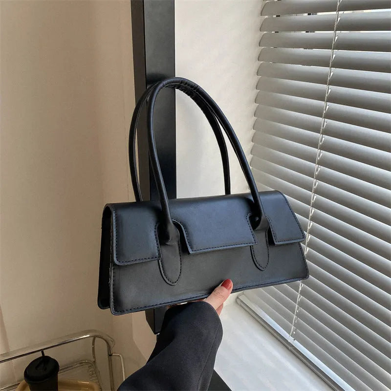 Women's horizontal square PU shoulder bag with stitching detail and single strap in black colour