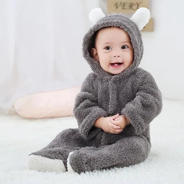 Unisex baby winter romper in cotton blend, O-neck pullover, available in eight colours and sizes 0 3M to 9 12M.