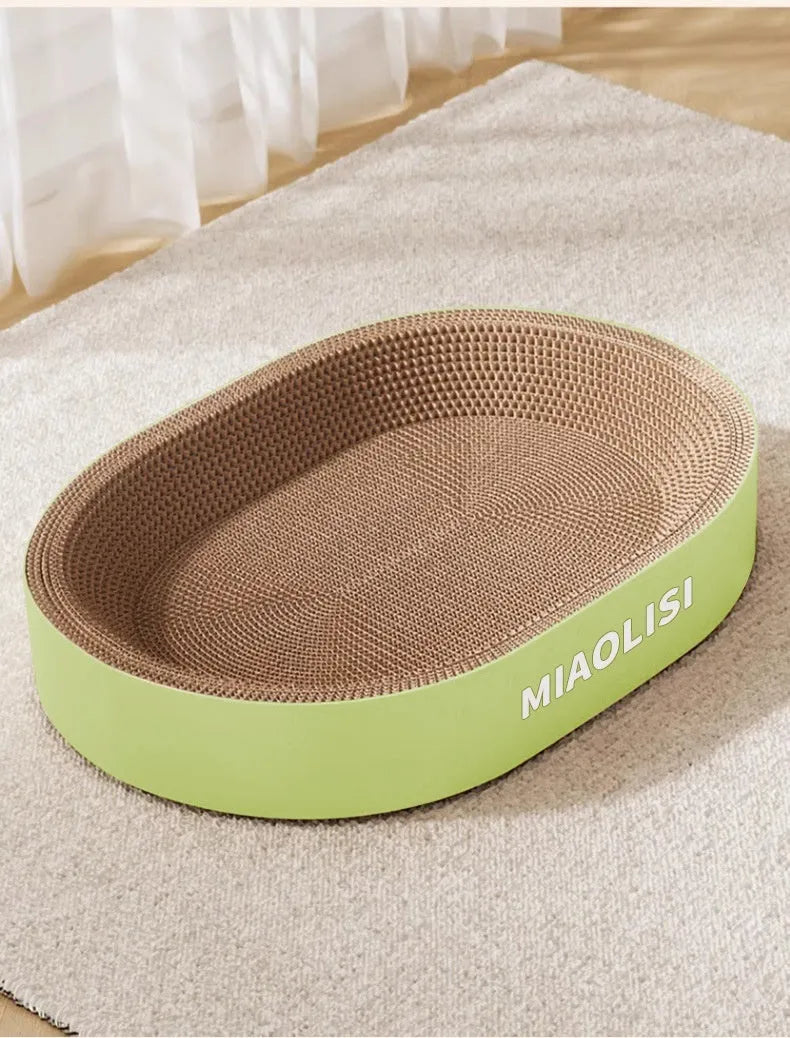 Green oval corrugated paper cat scratch board nest measuring 55 cm in diameter