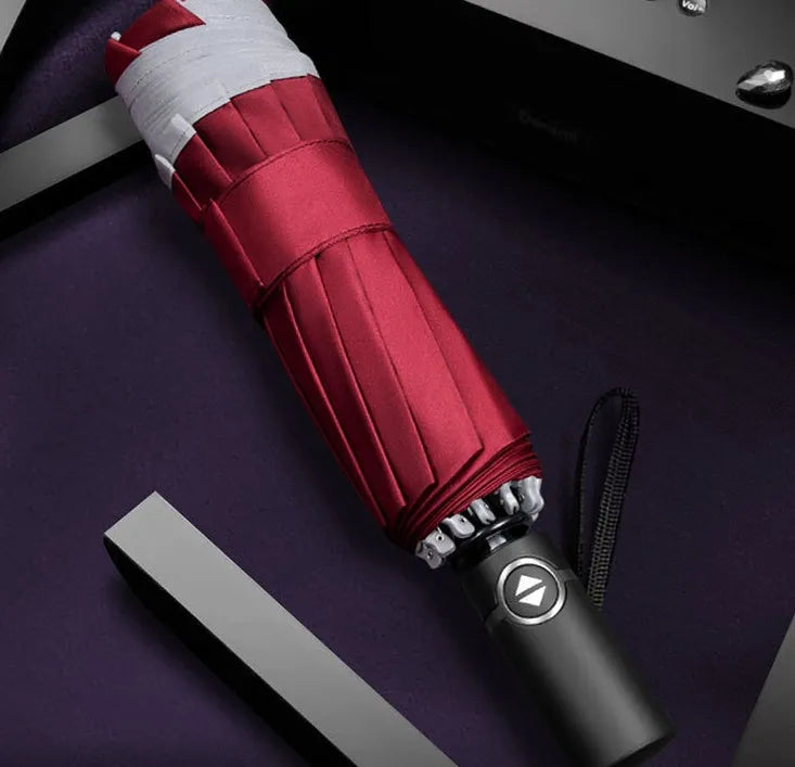 Inverted umbrella with auto close button and reflective stripes on black canopy