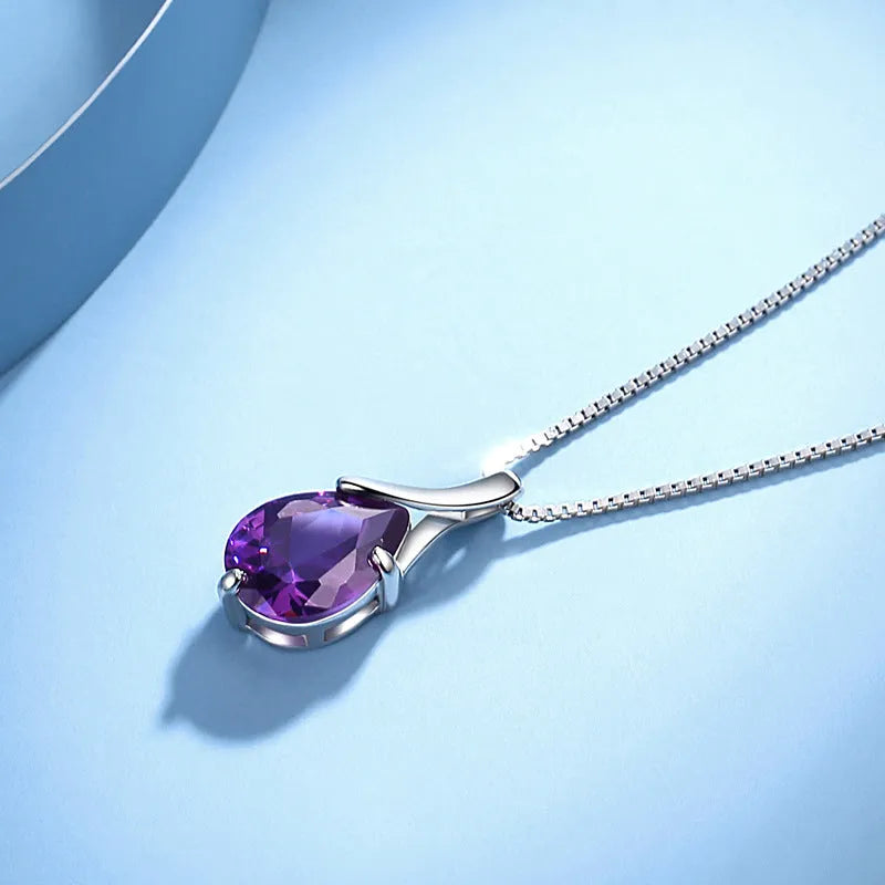 Sterling silver S925 pendant with amethyst stone and diamond-like accents on white background