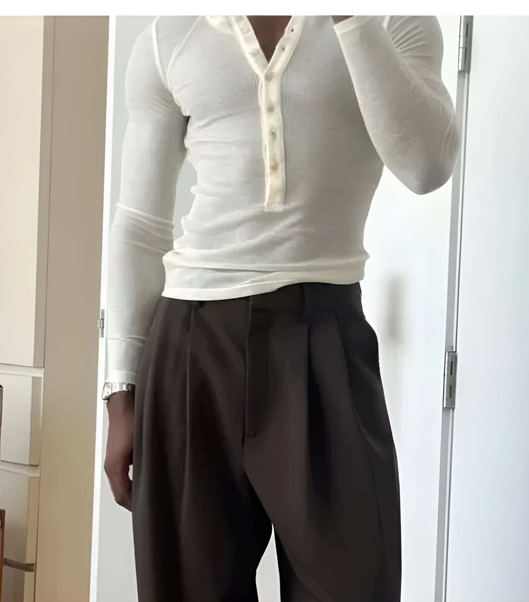 Cream-coloured men's ribbed long-sleeve henley top with a five-button placket.