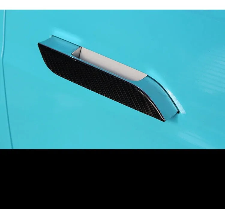 Four clear carbon fibre adhesive door handle protection patches for Tesla Model S interior.
