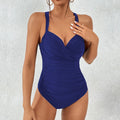 Women's solid colour one-piece swimsuit in black, blue, dark blue, or red with polyester fabric